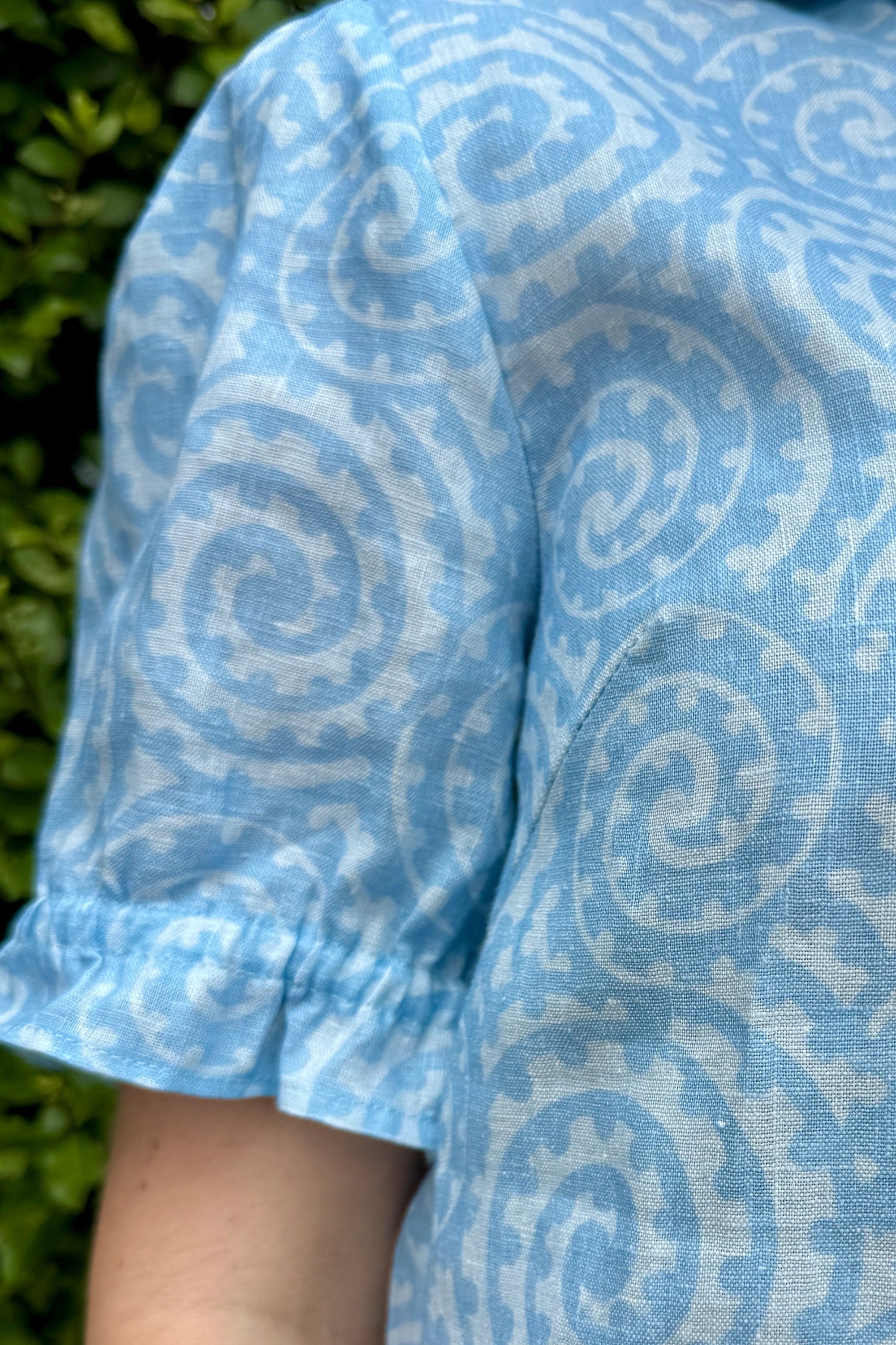 Womens Blouse with light blue spirals and NZ art.