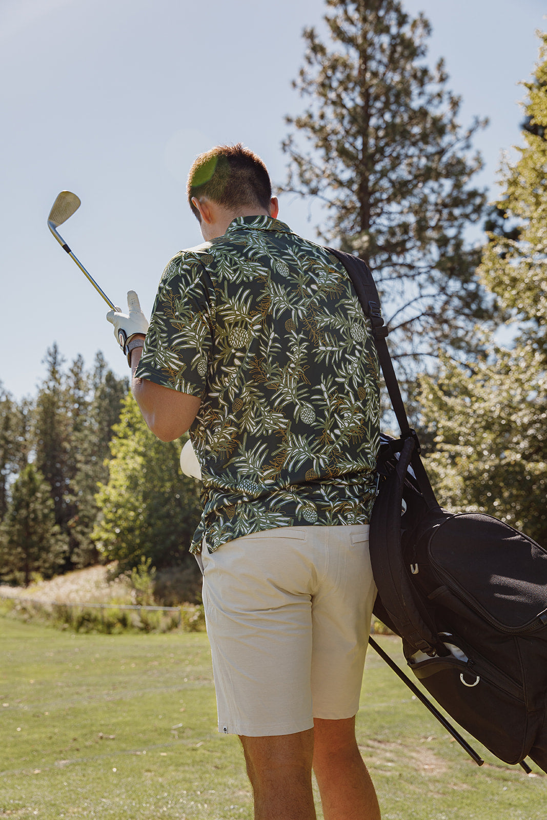 Kauri Men’s Golf Polo in deep green with native kauri design. NZ golf shirt made from breathable, moisture-wicking fabric for all-day comfort.