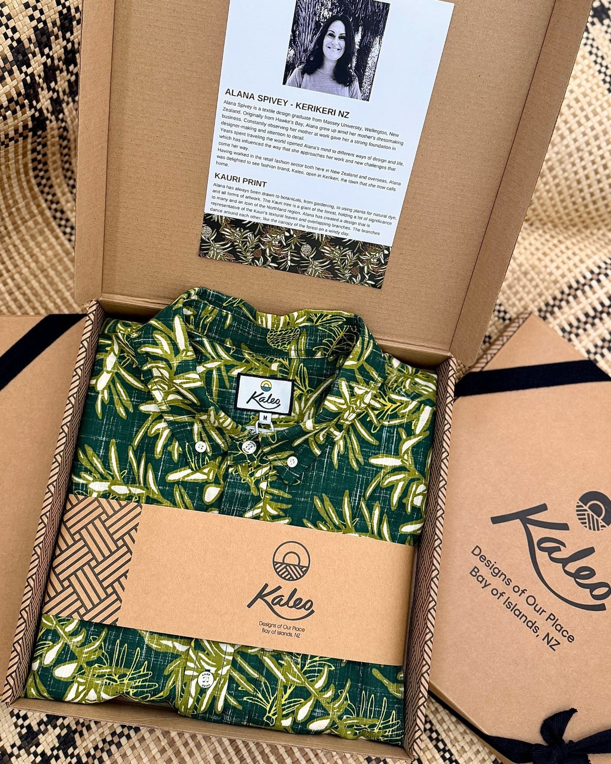Kauri Kiwi Classic men's short sleeve shirt featuring an all-over print of native New Zealand kauri leaves in dark and light green in a gift box.