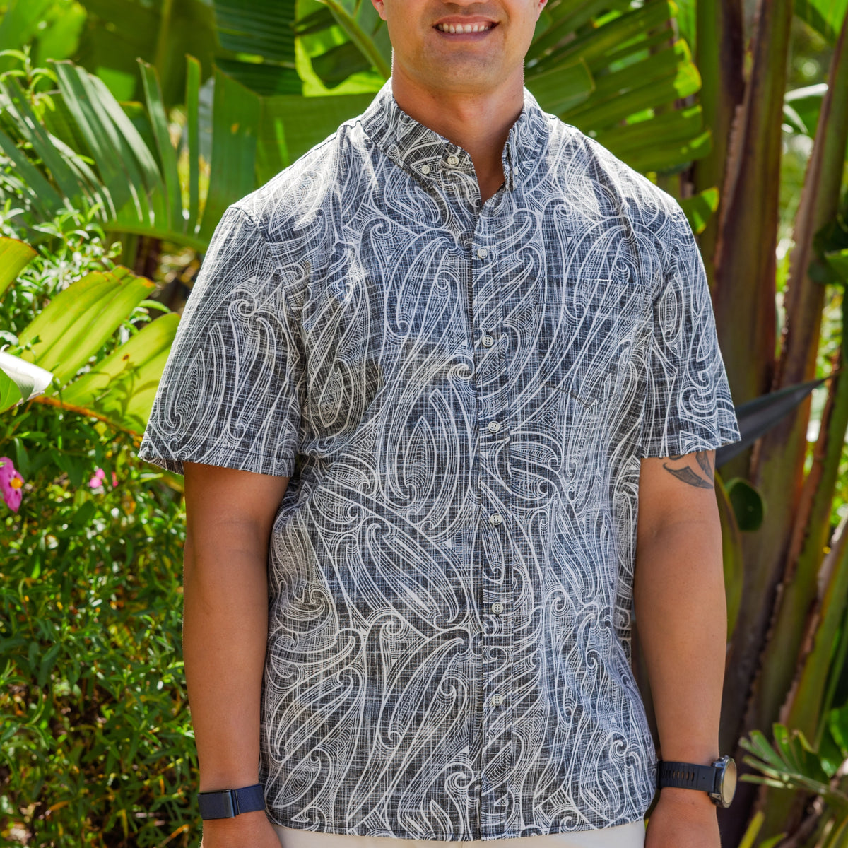 Kiwi Style Kōwhaiwhai men's relaxed-fit short sleeve shirt featuring an all-over Māori-inspired kōwhaiwhai pattern in black and white.