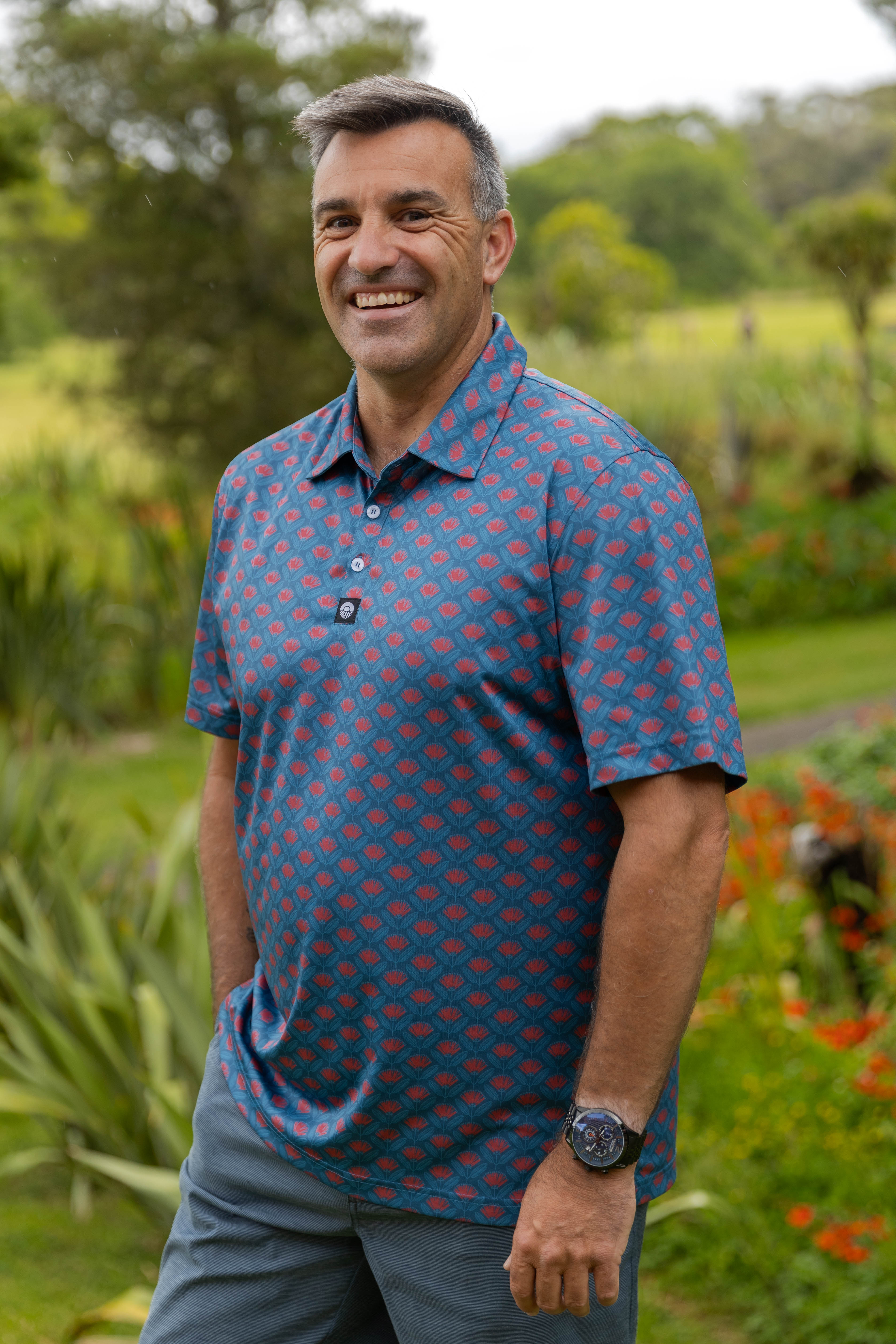 Men’s golf polo New Zealand – Pōhutukawa print, NZ-designed premium golf apparel by Kaleo; lightweight, breathable, comfortable-fit golf shirt