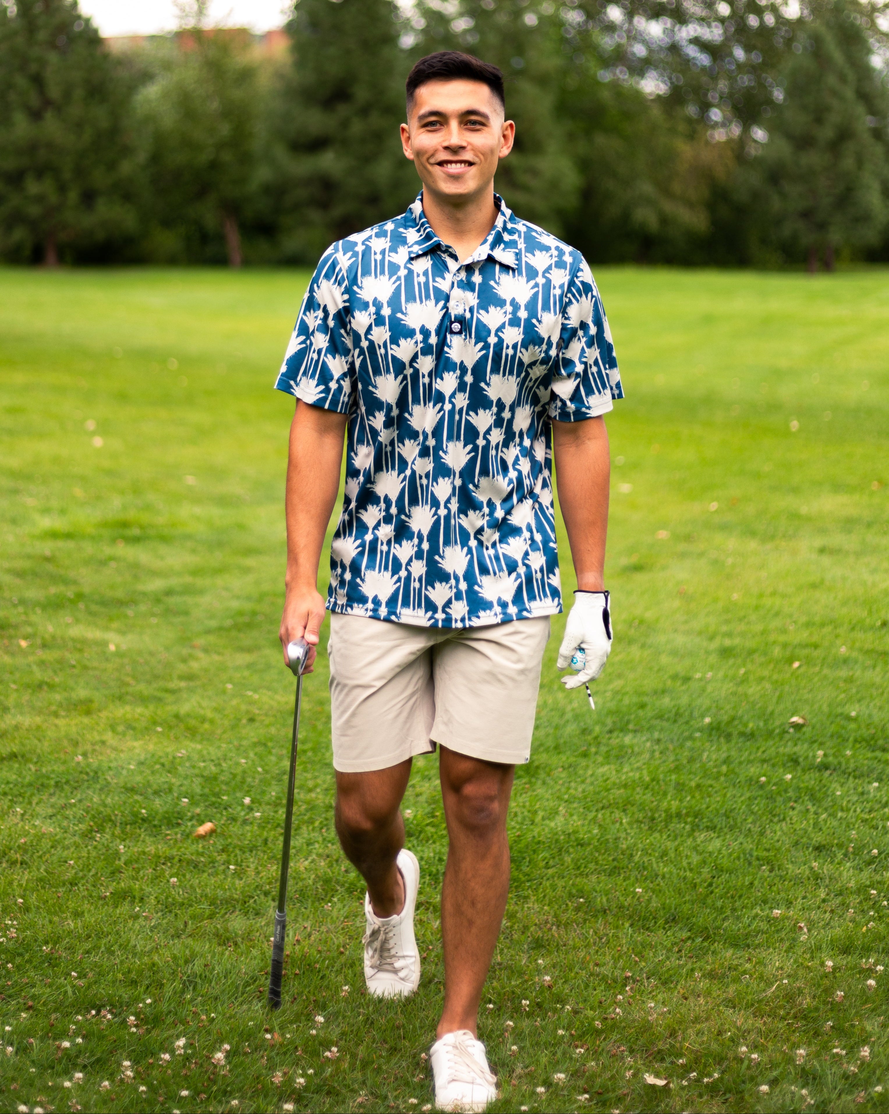 Men’s Nikau Palm golf polo shirt in blue and white with bold New Zealand native palm print – stylish and breathable golfwear by Kaleo