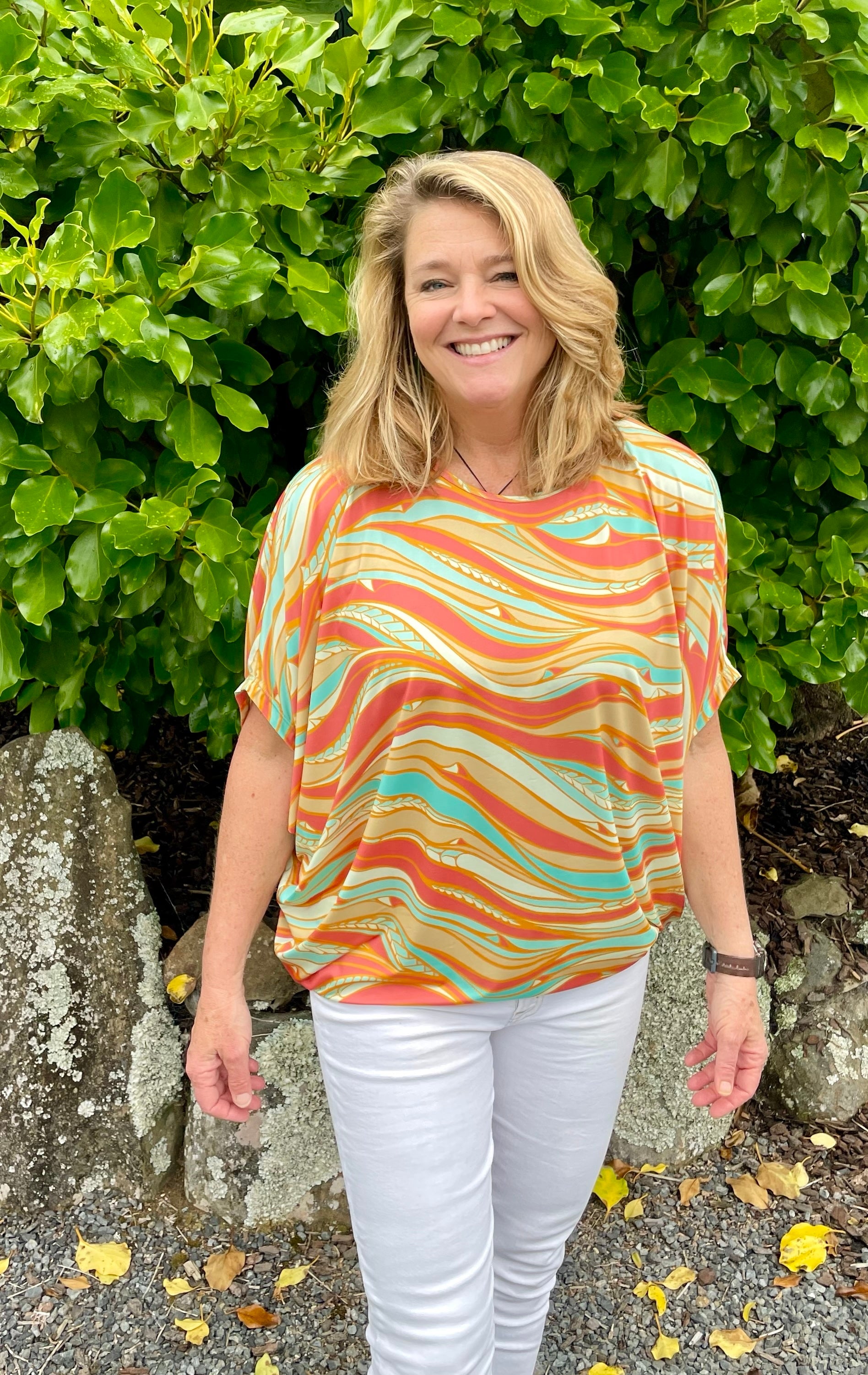 Women’s batwing top New Zealand – Te Rerenga coral print, NZ-designed wearable art by Kaleo; lightweight, travel-friendly women’s clothing with Kiwi style