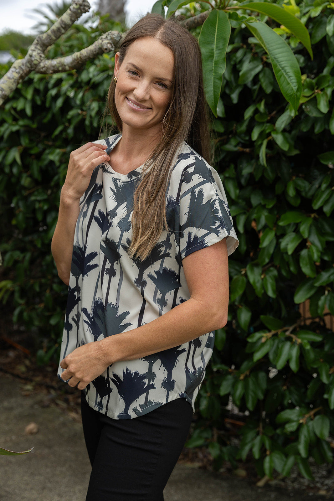 Women’s top New Zealand – Nikau palm print design, NZ-designed wearable art by Kaleo. Comfortable, travel-friendly women’s clothing with Kiwi style.