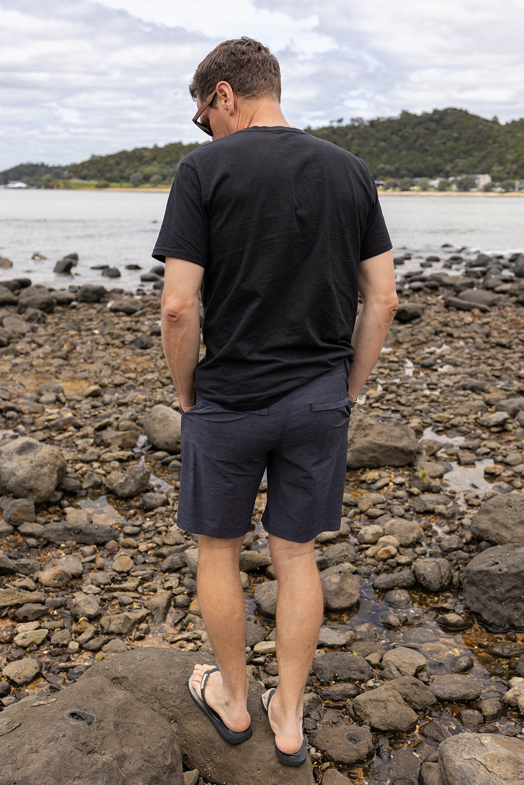 Men’s charcoal chino shorts with 4-way stretch. Comfortable slim-fit shorts designed for summer, casual wear, and travel in New Zealand.