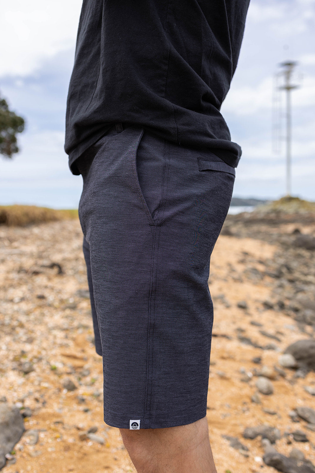 Men’s charcoal chino shorts with 4-way stretch. Comfortable slim-fit shorts designed for summer, casual wear, and travel in New Zealand.