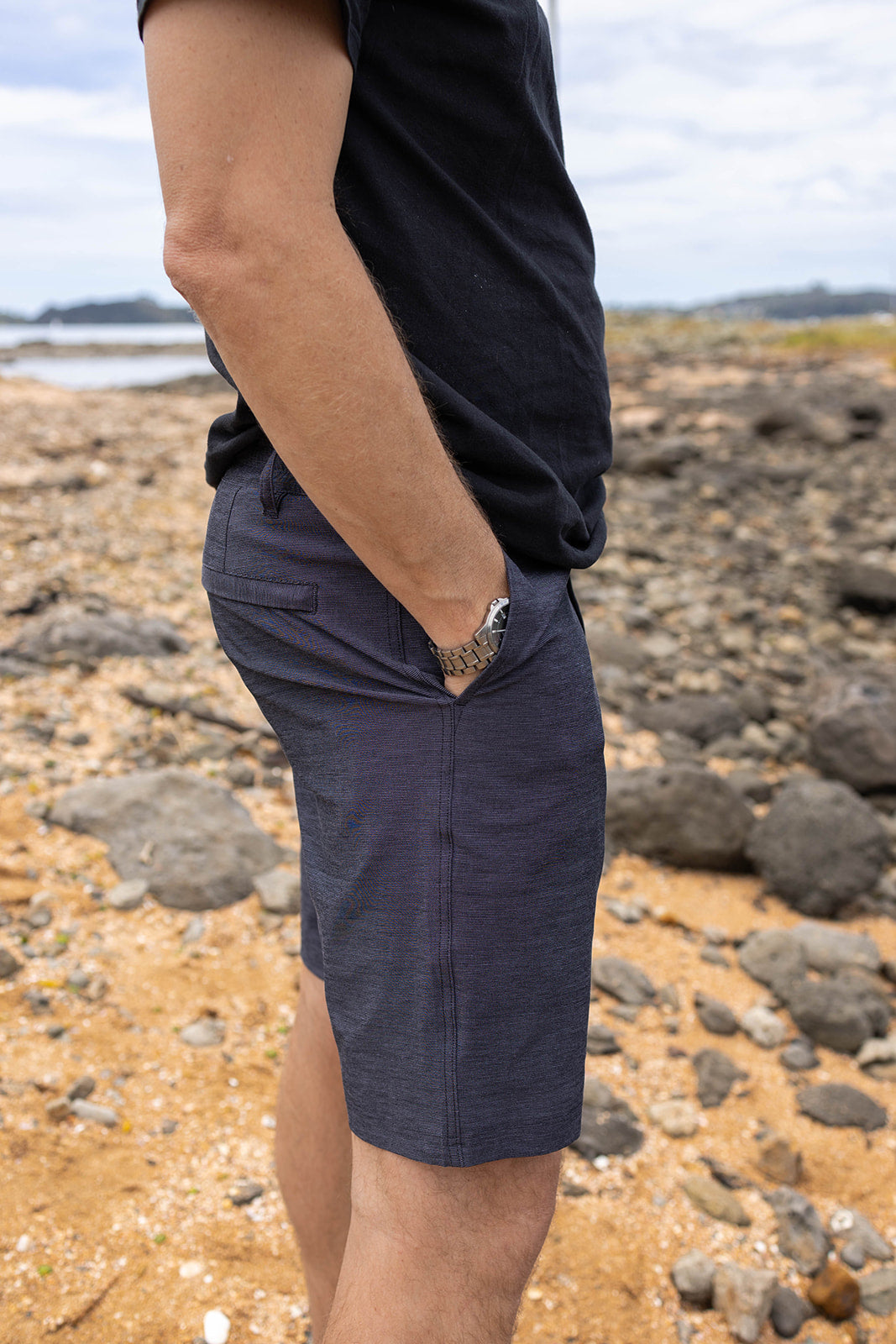 Men’s charcoal chino shorts with 4-way stretch. Comfortable slim-fit shorts designed for summer, casual wear, and travel in New Zealand.