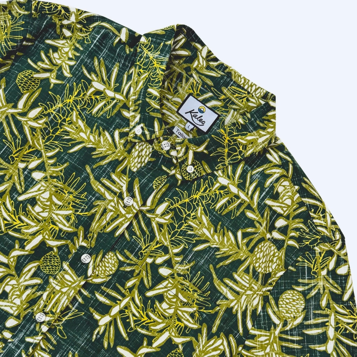 Kauri Kiwi Classic men's short sleeve shirt featuring an all-over print of native New Zealand kauri leaves in dark and light green.