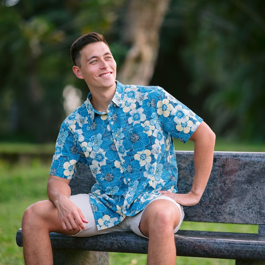 Men’s NZ Hibiscus Kiwi Classic short sleeve shirt with bold blue hibiscus print. Lightweight summer button-up shirt inspired by New Zealand style.