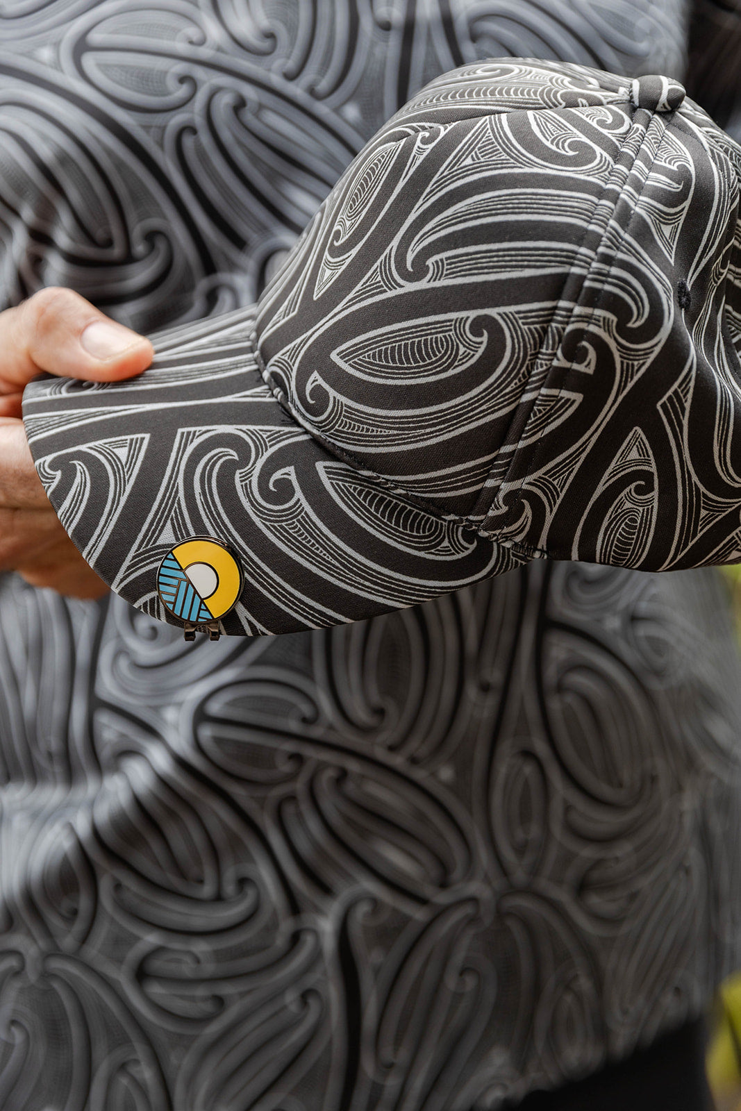 Accessories NZ – Kōwhaiwhai cap with Māori-inspired design, NZ-designed wearable art by Kaleo. Unique Kiwi gift and New Zealand souvenir hat