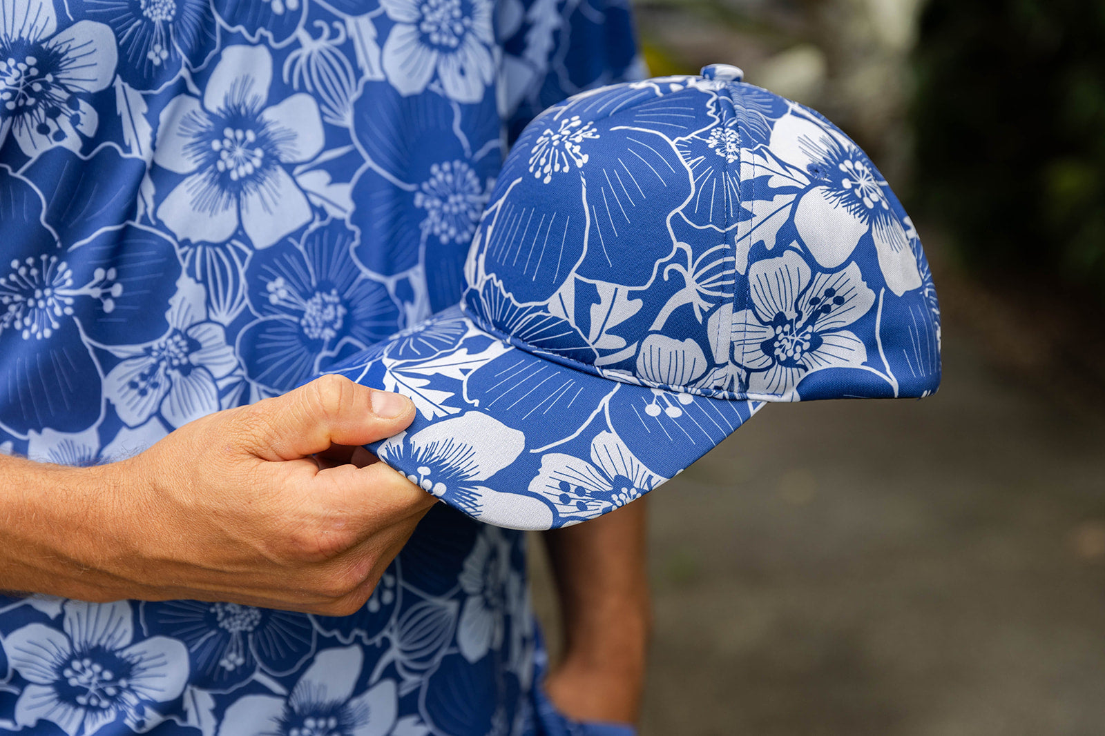 Accessories NZ – Hibiscus print cap, NZ-designed wearable art by Kaleo; blue floral hat, unique Kiwi gift and New Zealand souvenir.