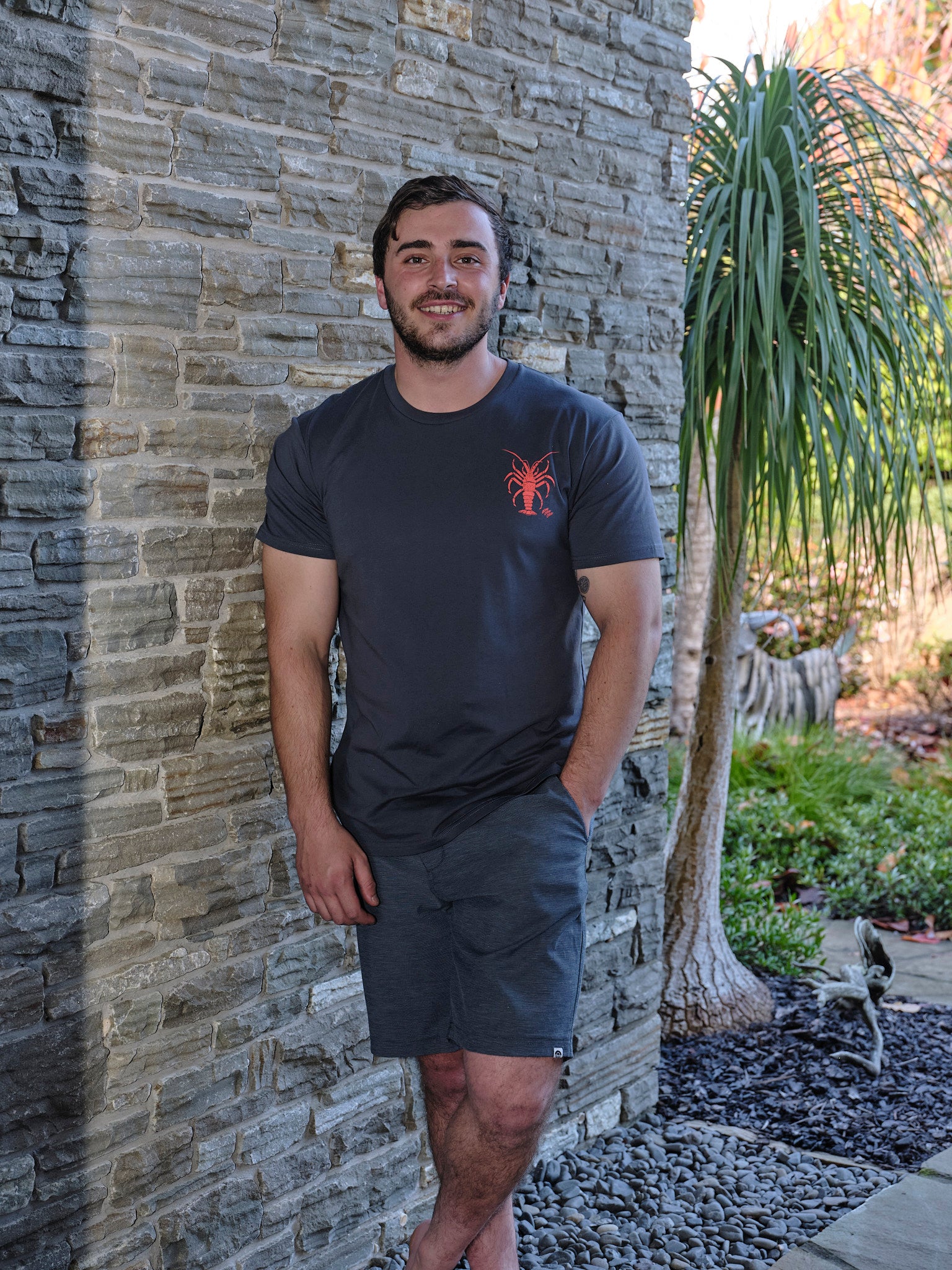 Men’s charcoal t-shirt with bold orange crayfish graphic and ‘Gone Cray Cray’ text – fun New Zealand seafood inspired tee