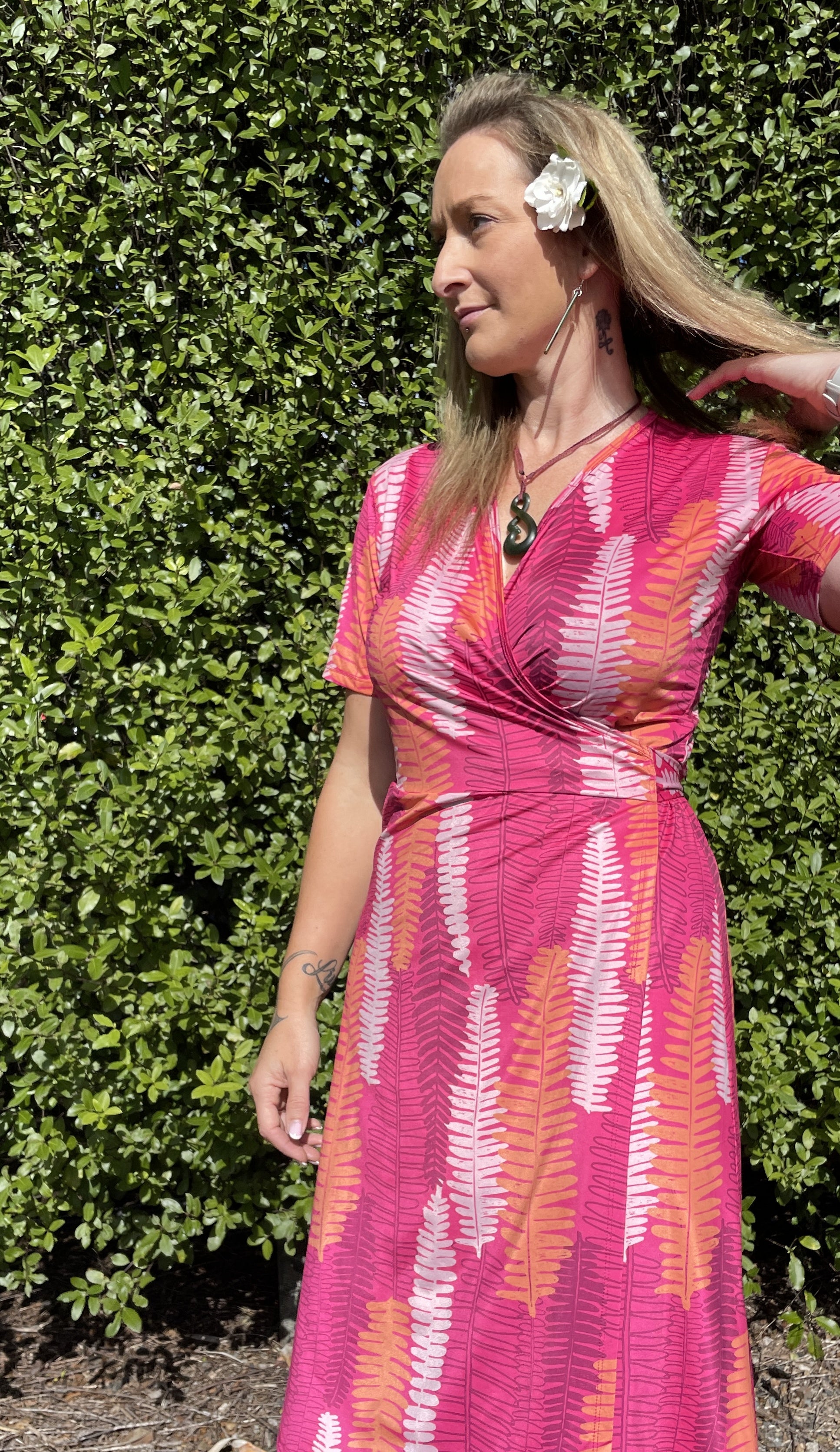Hot pink women’s wrap dress with Piupiu fern print – New Zealand inspired summer dress with short sleeves and flattering wrap style