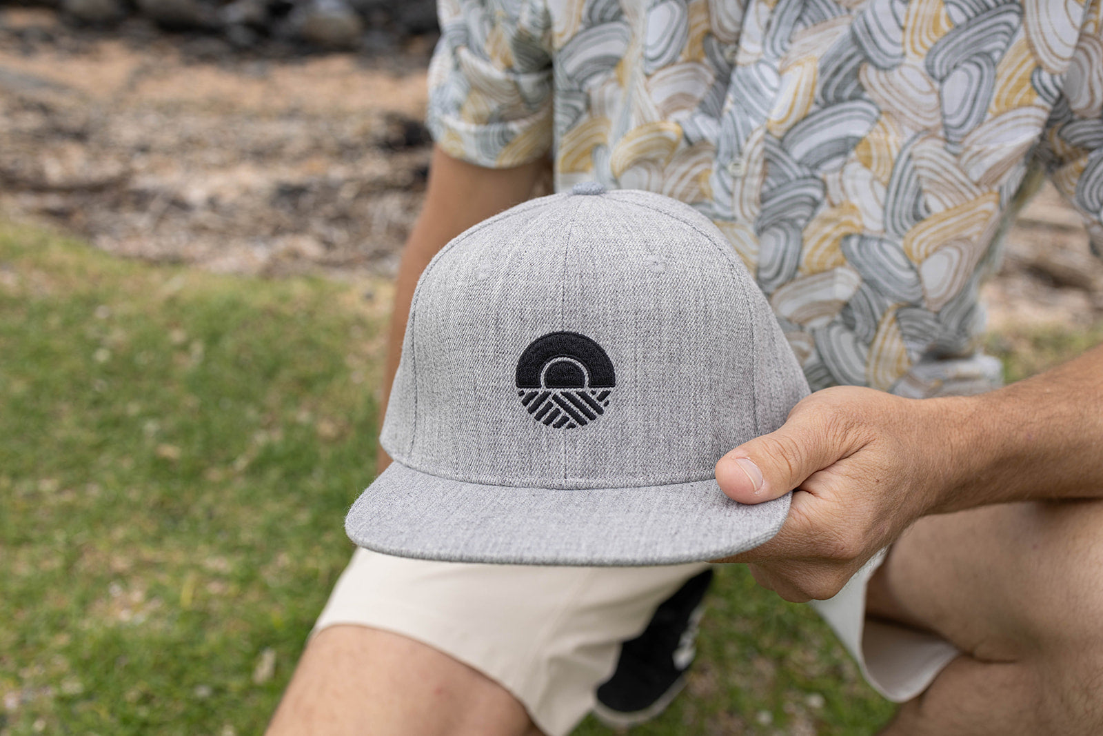 Kaleo Logo grey panel snapback hat, premium streetwear cap with embroidered Kaleo sun and sea logo, stylish unisex headwear for coastal living.