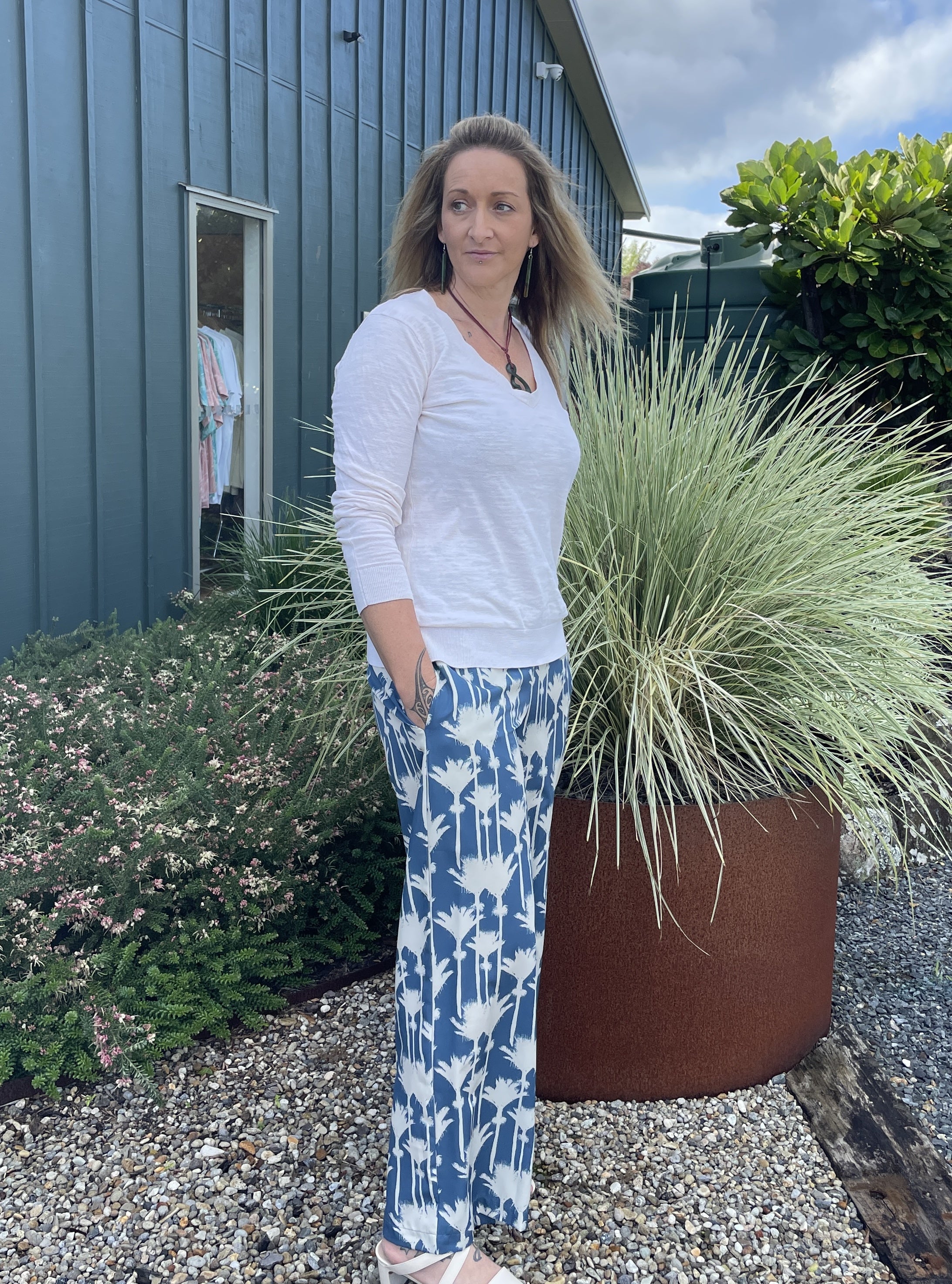 Women’s wide-leg smocked pants with blue and white Nikau palm print – relaxed fit New Zealand inspired resort wear