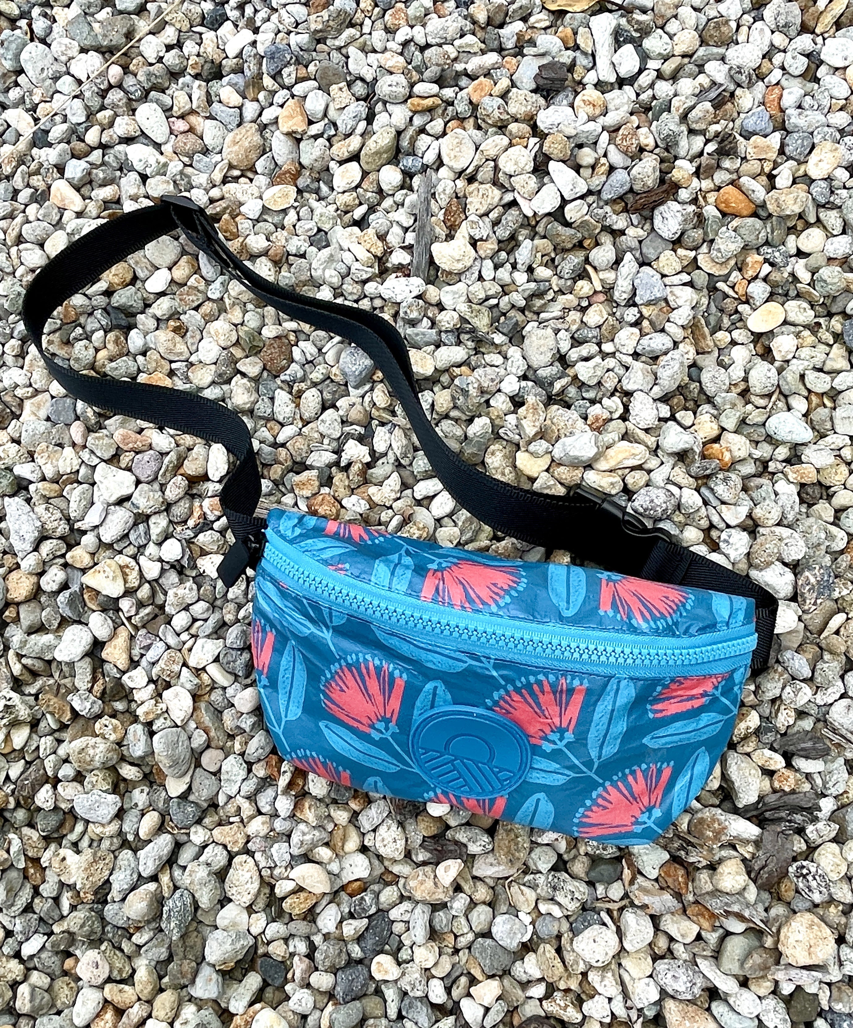 Accessories NZ – splashproof bum bag with Pōhutukawa floral print, NZ-designed travel waist bag by Kaleo; unique Kiwi gift and New Zealand souvenir