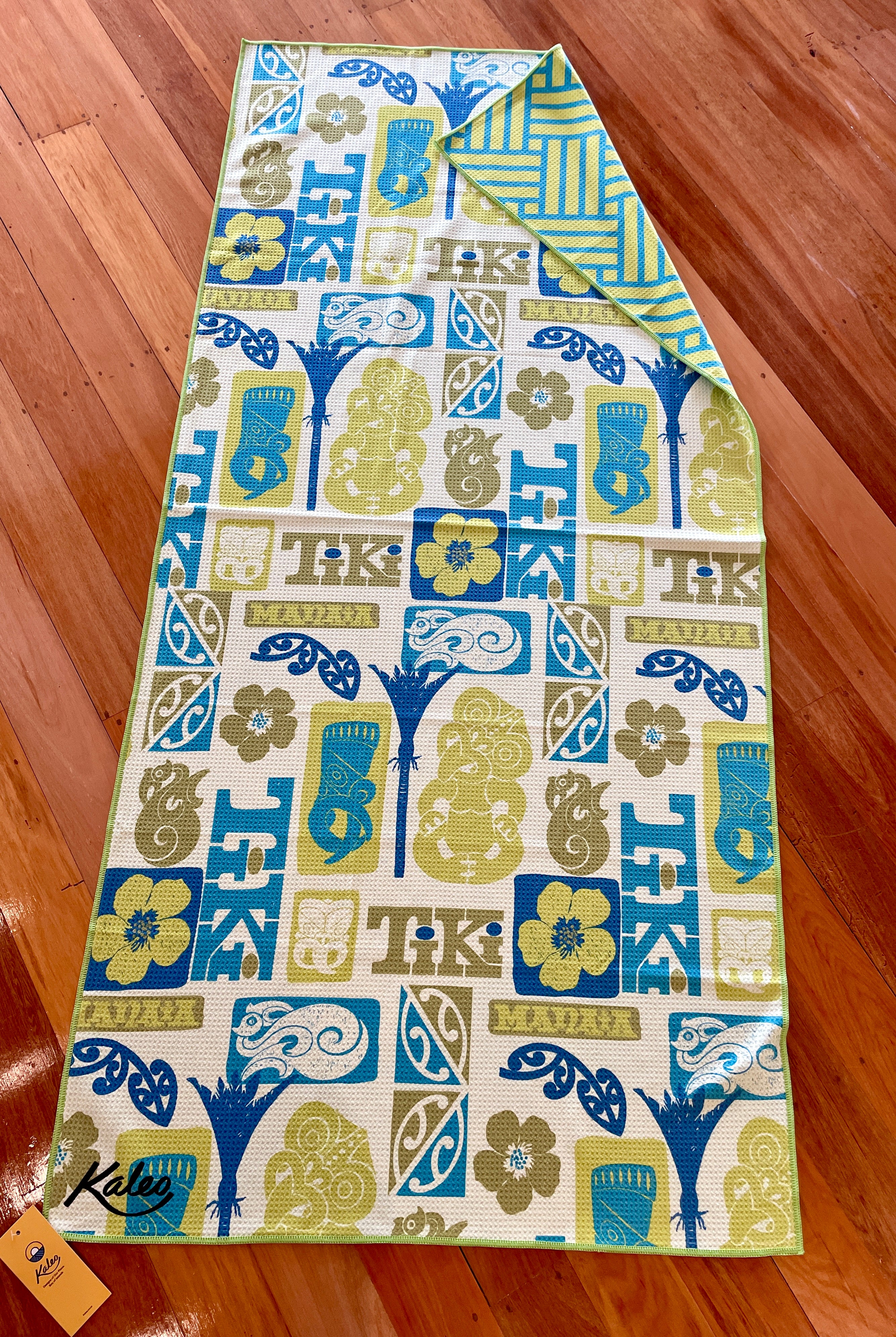 Tiki Manaia beach towel featuring Māori-inspired motifs and bold tiki artwork – quick-dry NZ designed towel by Kaleo