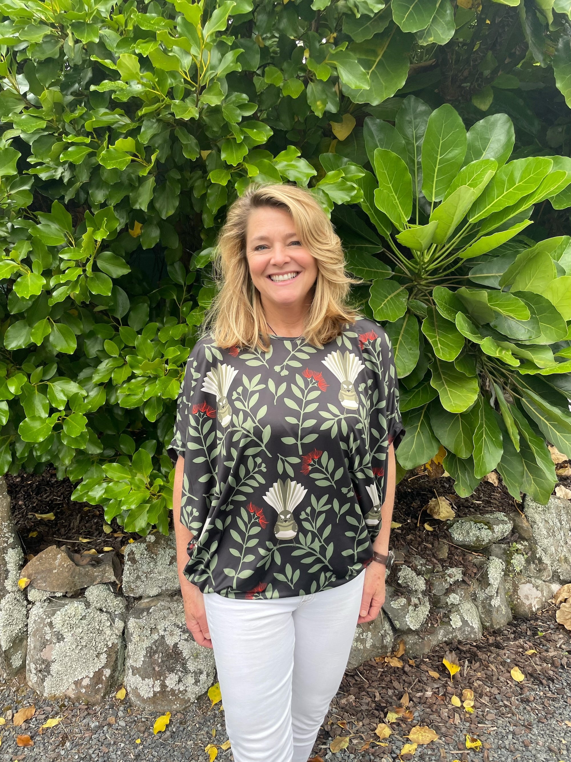 Women’s batwing top New Zealand – Fantail (Pīwakawaka) print, NZ-designed wearable art by Kaleo; relaxed, travel-friendly women’s fashion with Kiwi style.