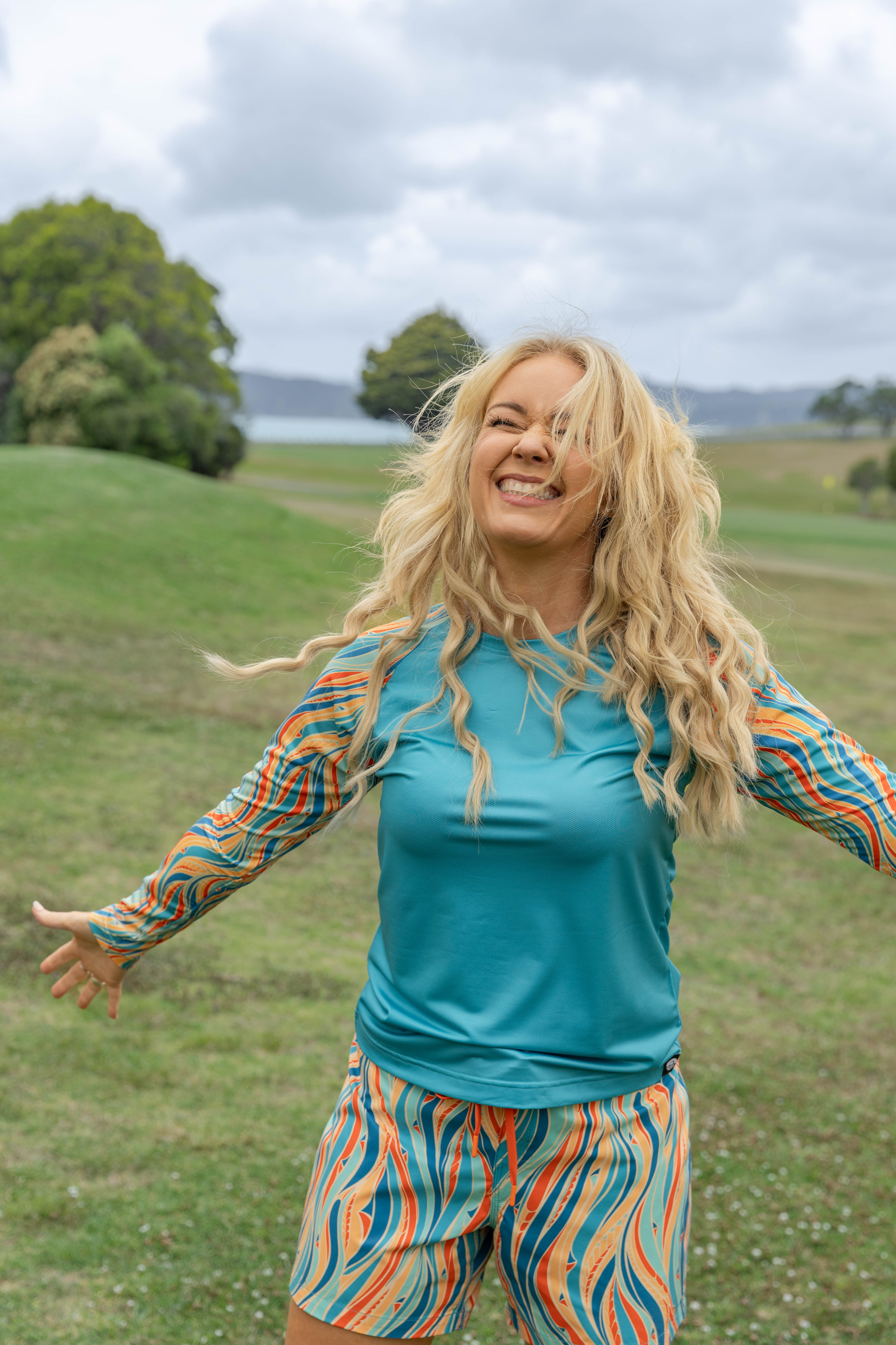 Women’s beachwear NZ – Rerenga print long sleeve beach shirt, NZ-designed clothing by Kaleo. Lightweight, sun-protective, travel-friendly holiday style.