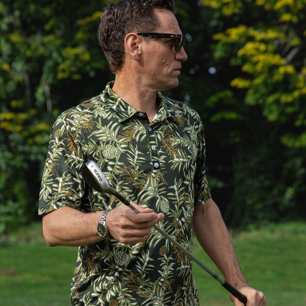 Kauri Men’s Golf Polo in deep green with native kauri design. NZ golf shirt made from breathable, moisture-wicking fabric for all-day comfort.