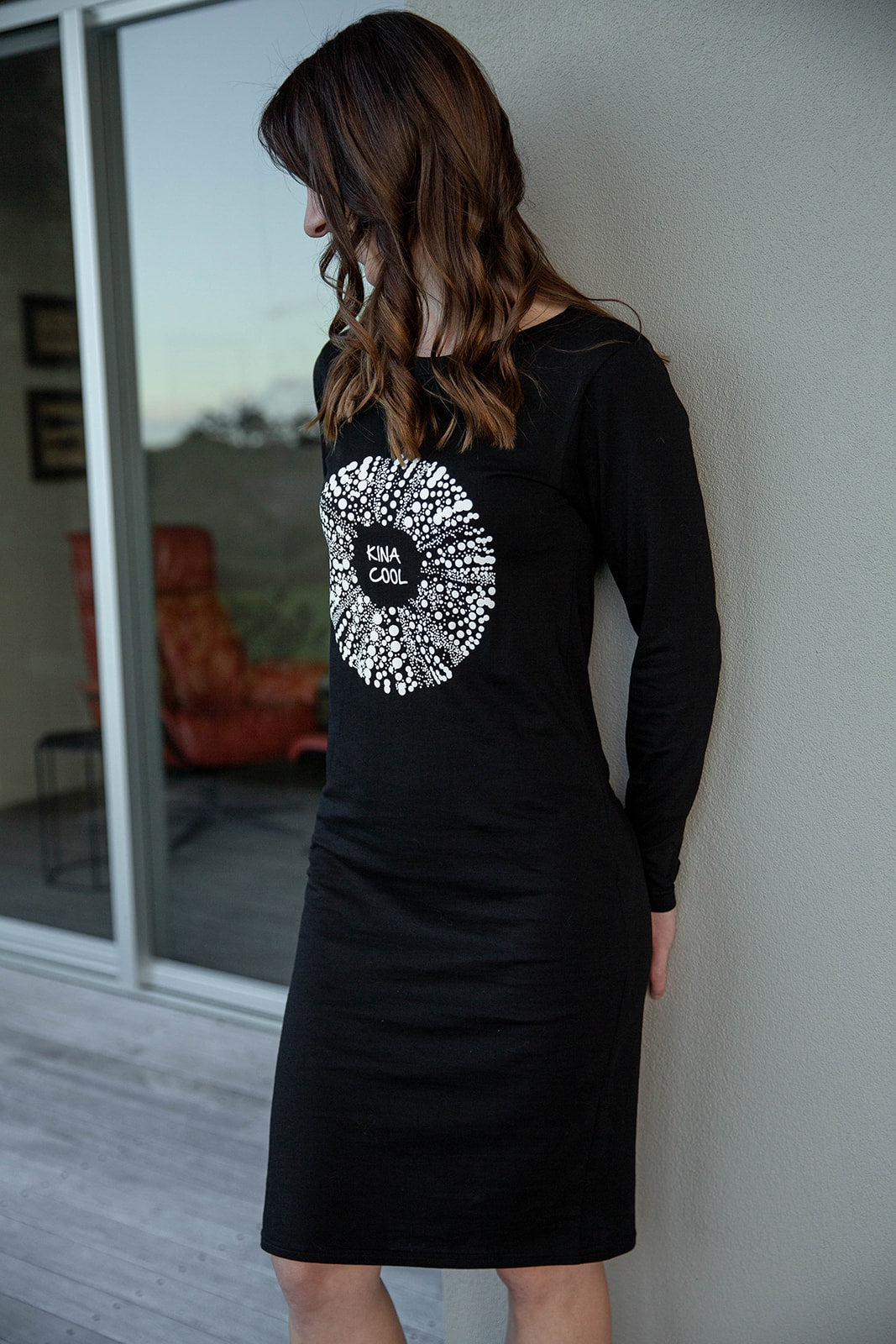 Kina Cool women’s black t-shirt dress with long sleeves, NZ-designed casual coastal style.
