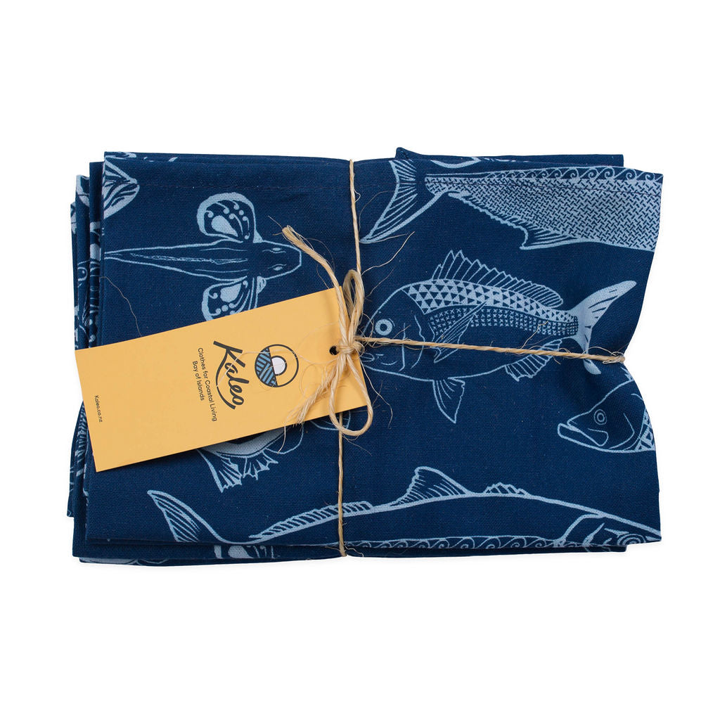 Kaleo BOI Catch Napkins set of 4 in navy blue with white NZ fish illustrations, eco-friendly cotton napkins perfect for coastal dining, Bay of Islands picnics, and seaside table settings